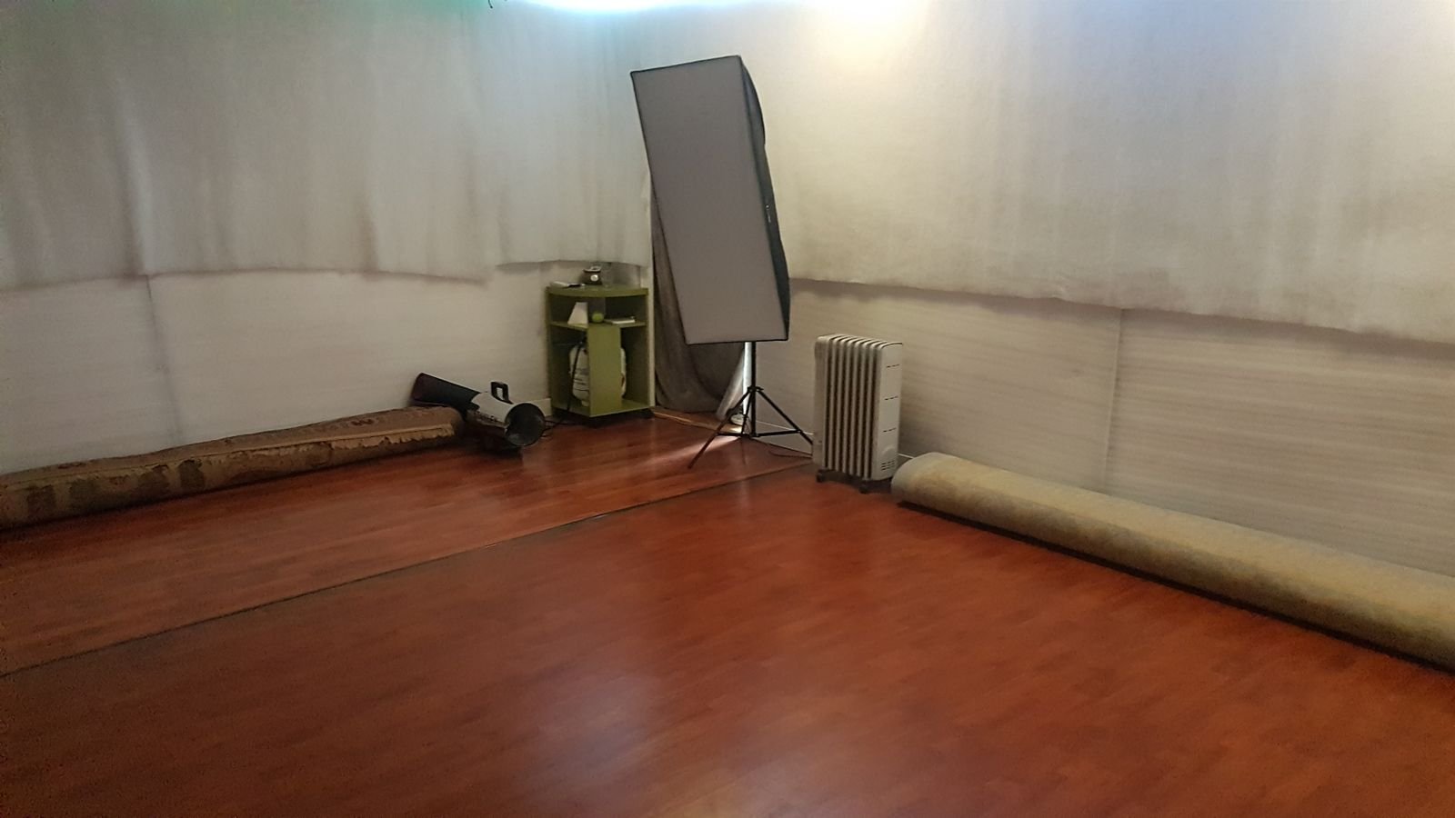 The finished CLOUD Studio with wood movement floor, padded walls, heater, and studio equipment.