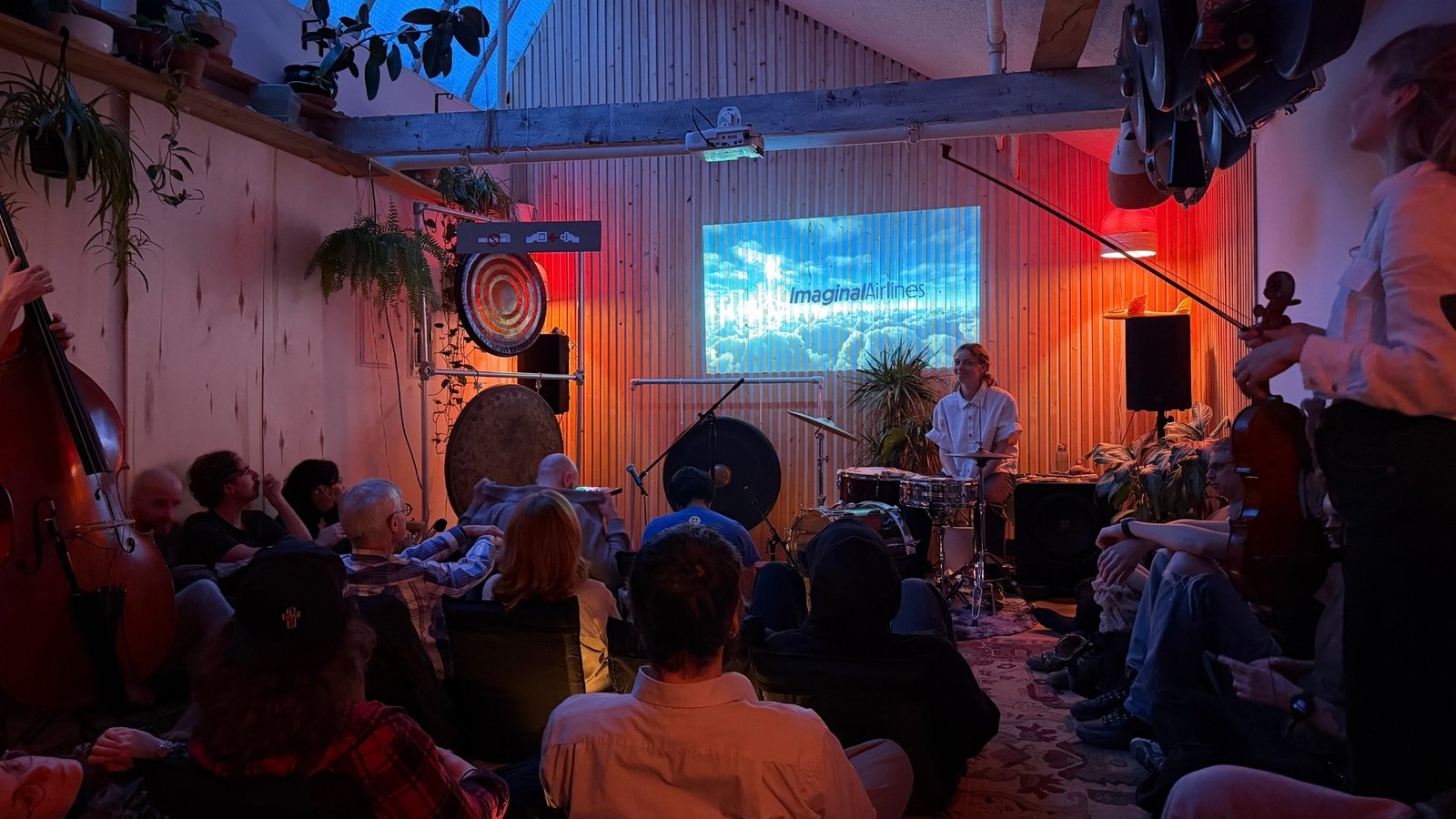 Audience and musicians gathered for an Imaginal Airlines performance at Hypha Arts