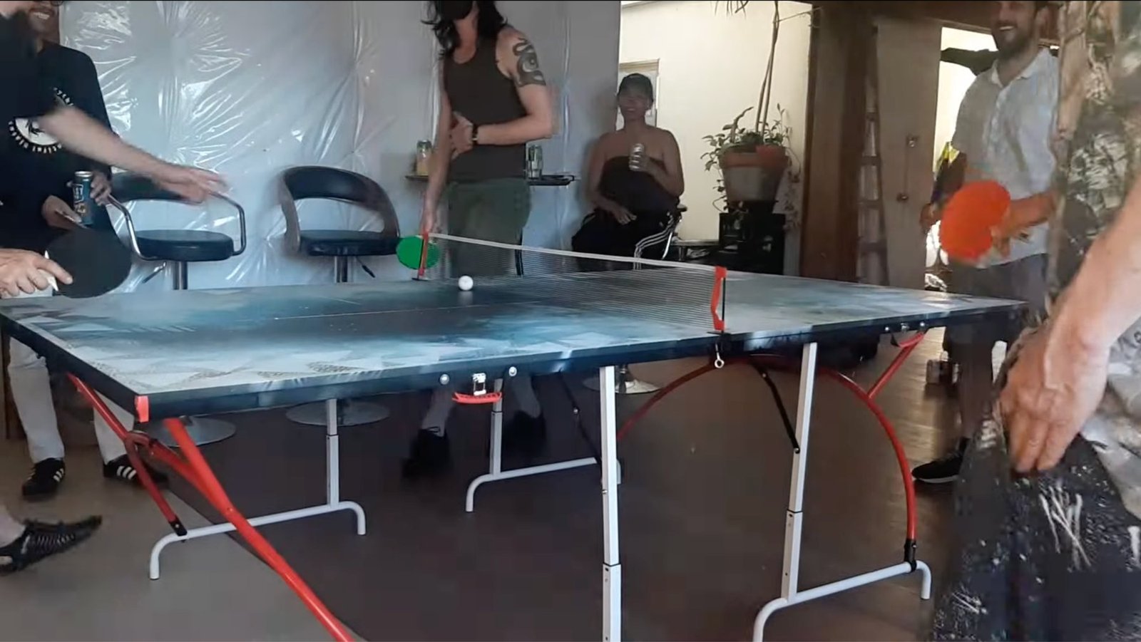 Participants play Sonic Ping-Pong together during an indoor community activation.