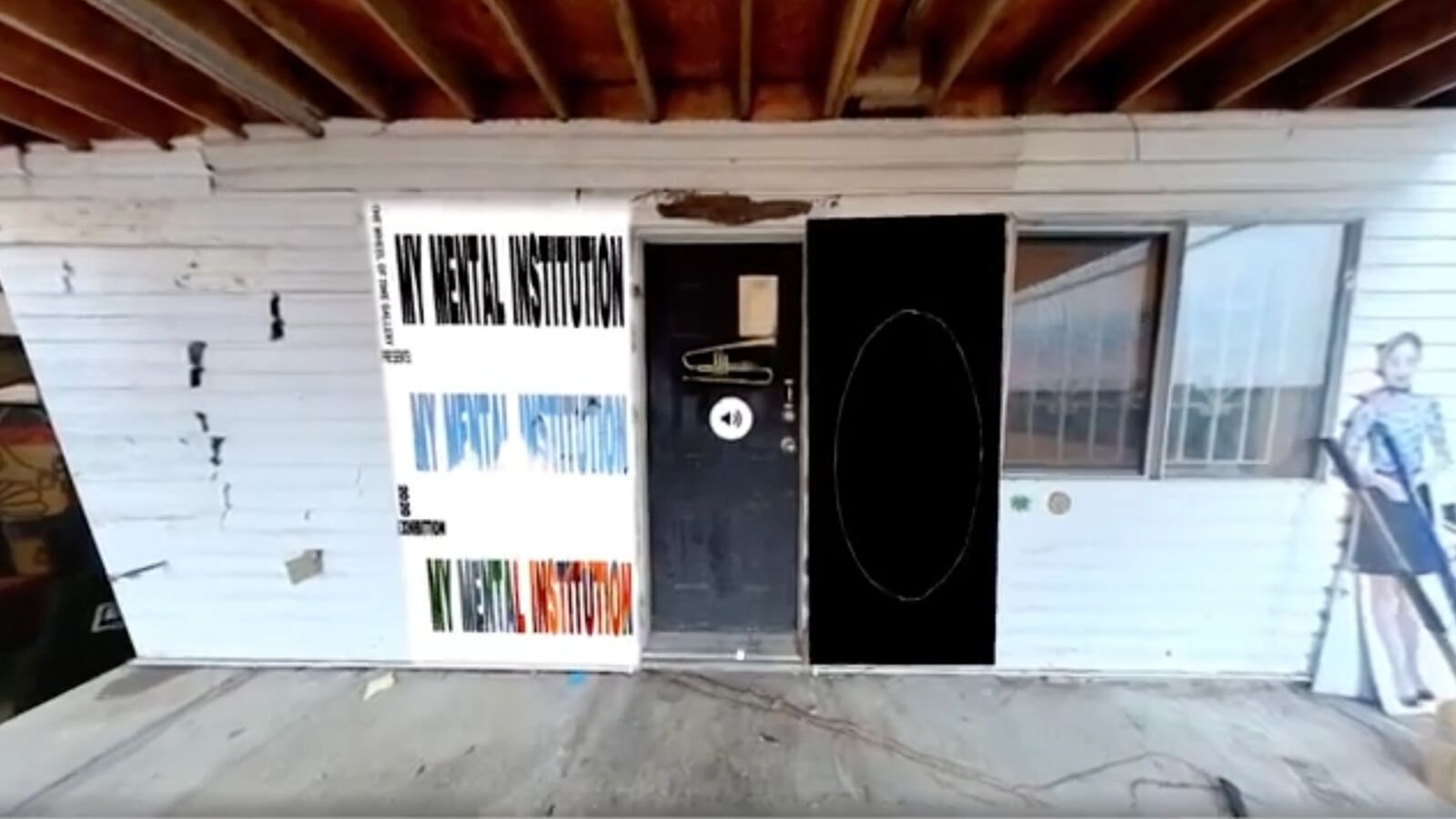 Exterior threshold of My Mental Institution with repeated title panels and a black doorway