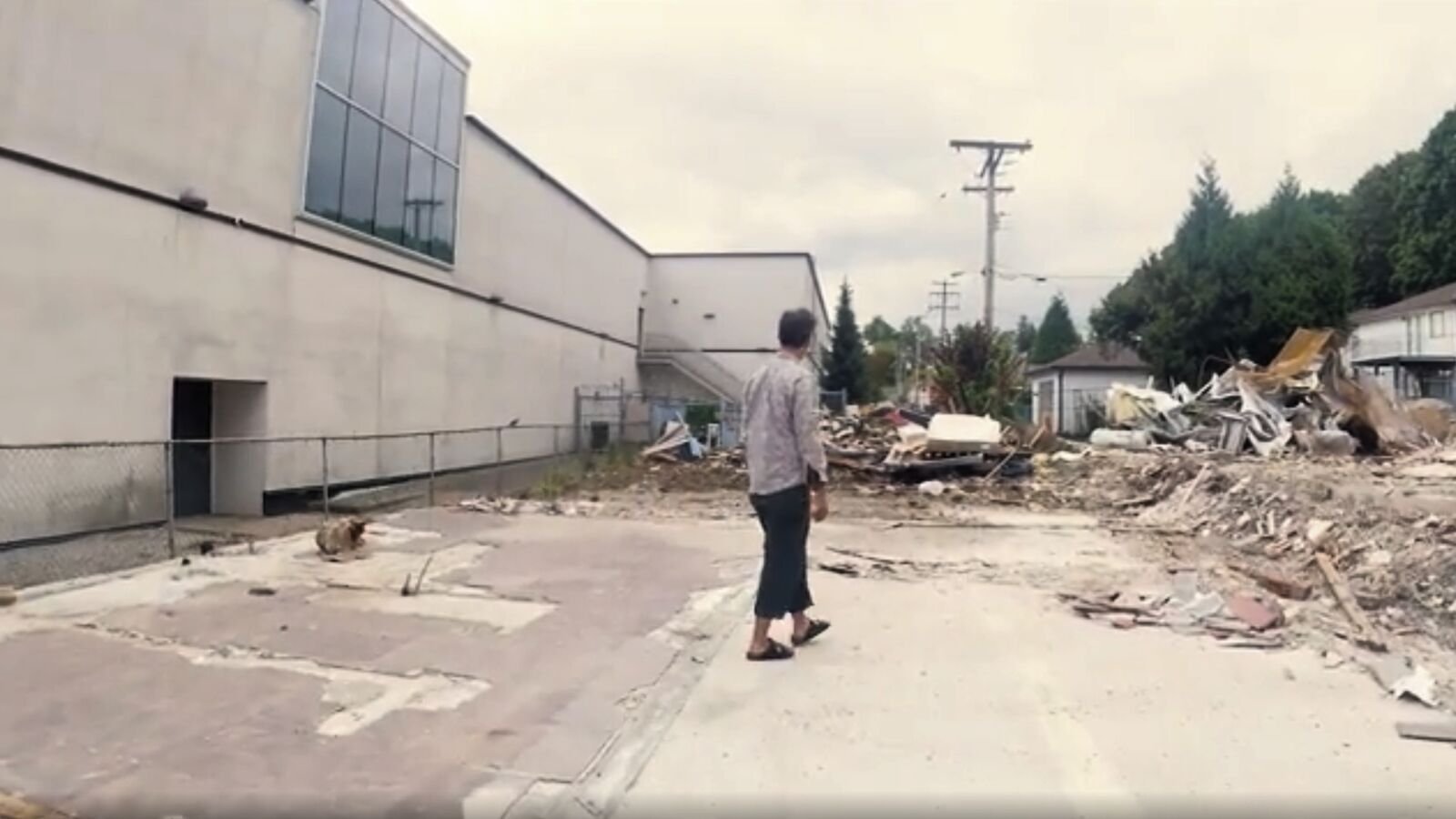 Raj Gill walking through the cleared site after the Wheel of Time Gallery house was demolished